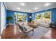 Cozy living room with bay window and hardwood floors at 513 Montrose Ave, Temple Terrace, FL 33617