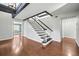 Modern staircase with black and white railings at 513 Montrose Ave, Temple Terrace, FL 33617