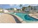 Inviting community swimming pool with plenty of lounge chairs at 5916 Canal Dr # J35, Bradenton, FL 34207