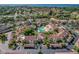 An aerial view of a community with a central pool and Spanish-style architecture at 6101 34Th W St # 29C, Bradenton, FL 34210