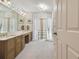 Spacious bathroom with double vanity and a view of another room at 6101 34Th W St # 29C, Bradenton, FL 34210