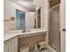 Bathroom with corner vanity, large mirror, and shower at 6101 34Th W St # 29C, Bradenton, FL 34210