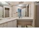 Bathroom with corner vanity, large mirror, and shower at 6101 34Th W St # 29C, Bradenton, FL 34210