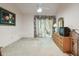 Bedroom with patio access, dresser, and ceiling fan at 6101 34Th W St # 29C, Bradenton, FL 34210