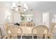 Light-filled dining room with a chandelier and built-in cabinetry at 6101 34Th W St # 29C, Bradenton, FL 34210