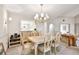 Dining room features a large table, chandelier, and access to kitchen at 6101 34Th W St # 29C, Bradenton, FL 34210