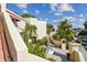 Condo building exterior with lush landscaping and fountain at 6101 34Th W St # 29C, Bradenton, FL 34210