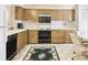 Light wood kitchen cabinets, appliances and flooring at 6101 34Th W St # 29C, Bradenton, FL 34210