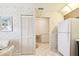 Bright kitchen features wood cabinets, tile floor, and a built-in breakfast nook at 6101 34Th W St # 29C, Bradenton, FL 34210