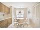 Cozy eat-in kitchen with wood cabinets, tile floor, and a round table with chairs at 6101 34Th W St # 29C, Bradenton, FL 34210