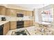 Light wood kitchen cabinets, appliances, and breakfast nook at 6101 34Th W St # 29C, Bradenton, FL 34210
