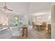 Living room with access to screened patio and dining area at 6101 34Th W St # 29C, Bradenton, FL 34210