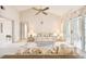 Living room with vaulted ceiling, carpet, and floral couches at 6101 34Th W St # 29C, Bradenton, FL 34210
