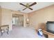 Living room with view into another room and ceiling fan at 6101 34Th W St # 29C, Bradenton, FL 34210
