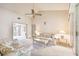 Bright living room boasts vaulted ceilings, neutral carpet, and access to a patio at 6101 34Th W St # 29C, Bradenton, FL 34210