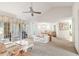 Spacious living room with vaulted ceiling, carpet, and access to a patio at 6101 34Th W St # 29C, Bradenton, FL 34210