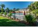 Community pool with a white fence and lush landscaping at 6101 34Th W St # 29C, Bradenton, FL 34210