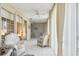 Sunroom with tiled floors, ceiling fan, and sliding glass doors at 6101 34Th W St # 29C, Bradenton, FL 34210