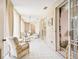 Relaxing sunroom with tiled floors and wicker furniture at 6101 34Th W St # 29C, Bradenton, FL 34210