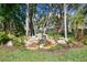 Serene waterfall feature surrounded by tropical plants at 6101 34Th W St # 29C, Bradenton, FL 34210