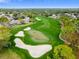 Aerial view of golf course and residential homes at 6474 Pine Meadows Dr, Spring Hill, FL 34606