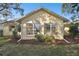 Cute yellow home with large windows at 6474 Pine Meadows Dr, Spring Hill, FL 34606