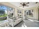 Relaxing sunroom with wicker furniture and ample natural light at 6474 Pine Meadows Dr, Spring Hill, FL 34606