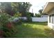 Large backyard with a white vinyl fence and lush landscaping at 6760 11Th N Ave, St Petersburg, FL 33710