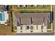 Two townhouses with grey roofs and driveways at 7689 Imagination Pl, Wesley Chapel, FL 33545