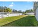 Large grassy backyard with a privacy fence at 8747 Glen Lakes N Blvd, St Petersburg, FL 33702