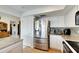 Kitchen features stainless steel refrigerator and granite countertops at 925 Golf Island Dr, Apollo Beach, FL 33572