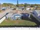 Aerial view showcasing a house's exterior and fenced backyard at 9425 Lido Ln, Port Richey, FL 34668