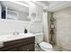 Clean bathroom with shower, tiled walls, and a modern vanity at 9425 Lido Ln, Port Richey, FL 34668