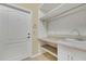 Laundry Room with cabinets, shelving, and a utility sink at 9739 Asbel Estates St, Land O Lakes, FL 34638