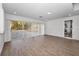 Finished basement with sliding doors leading to the outdoors at 9800 Mendel Dr, New Port Richey, FL 34654