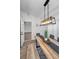 Modern dining room with long wooden table and bench seating at 9800 Mendel Dr, New Port Richey, FL 34654