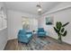Bright living room featuring a gray sofa and stylish coffee table at 9800 Mendel Dr, New Port Richey, FL 34654