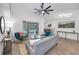 Spacious living room with hardwood floors, and access to the pool at 9800 Mendel Dr, New Port Richey, FL 34654