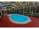 Refreshing kidney-shaped pool, perfect for relaxation at 9800 Mendel Dr, New Port Richey, FL 34654