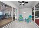 Relaxing screened porch with comfy chairs and view of the pool at 9800 Mendel Dr, New Port Richey, FL 34654