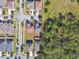 House with backyard and surrounding neighborhood view at 10703 Aldo Moro Dr, Wimauma, FL 33598