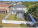 Aerial view of house and backyard with fenced area at 10703 Aldo Moro Dr, Wimauma, FL 33598