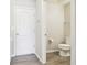 Convenient half bathroom with toilet and sink at 10703 Aldo Moro Dr, Wimauma, FL 33598