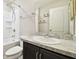 Clean bathroom with a tub shower combo and vanity at 10703 Aldo Moro Dr, Wimauma, FL 33598