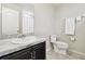 Simple bathroom with toilet, sink, and shower/tub combo at 10703 Aldo Moro Dr, Wimauma, FL 33598