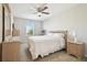 Bedroom with a queen-size bed and ceiling fan at 10703 Aldo Moro Dr, Wimauma, FL 33598