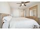 Bright bedroom with ceiling fan and double door closet at 10703 Aldo Moro Dr, Wimauma, FL 33598