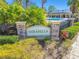 Mirabella community entrance sign with pool view at 10703 Aldo Moro Dr, Wimauma, FL 33598