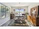 Charming dining room with a round table, four chairs, and a unique chandelier at 10703 Aldo Moro Dr, Wimauma, FL 33598