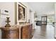 Elegant entryway with ornate console table and large painting at 10703 Aldo Moro Dr, Wimauma, FL 33598